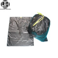 Black plastic garbage bags on roll with string